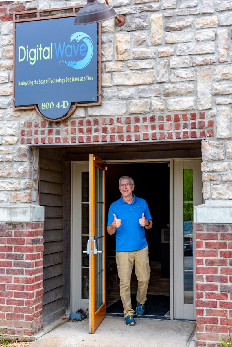 A Digital Wave team member at the Branson office entrance